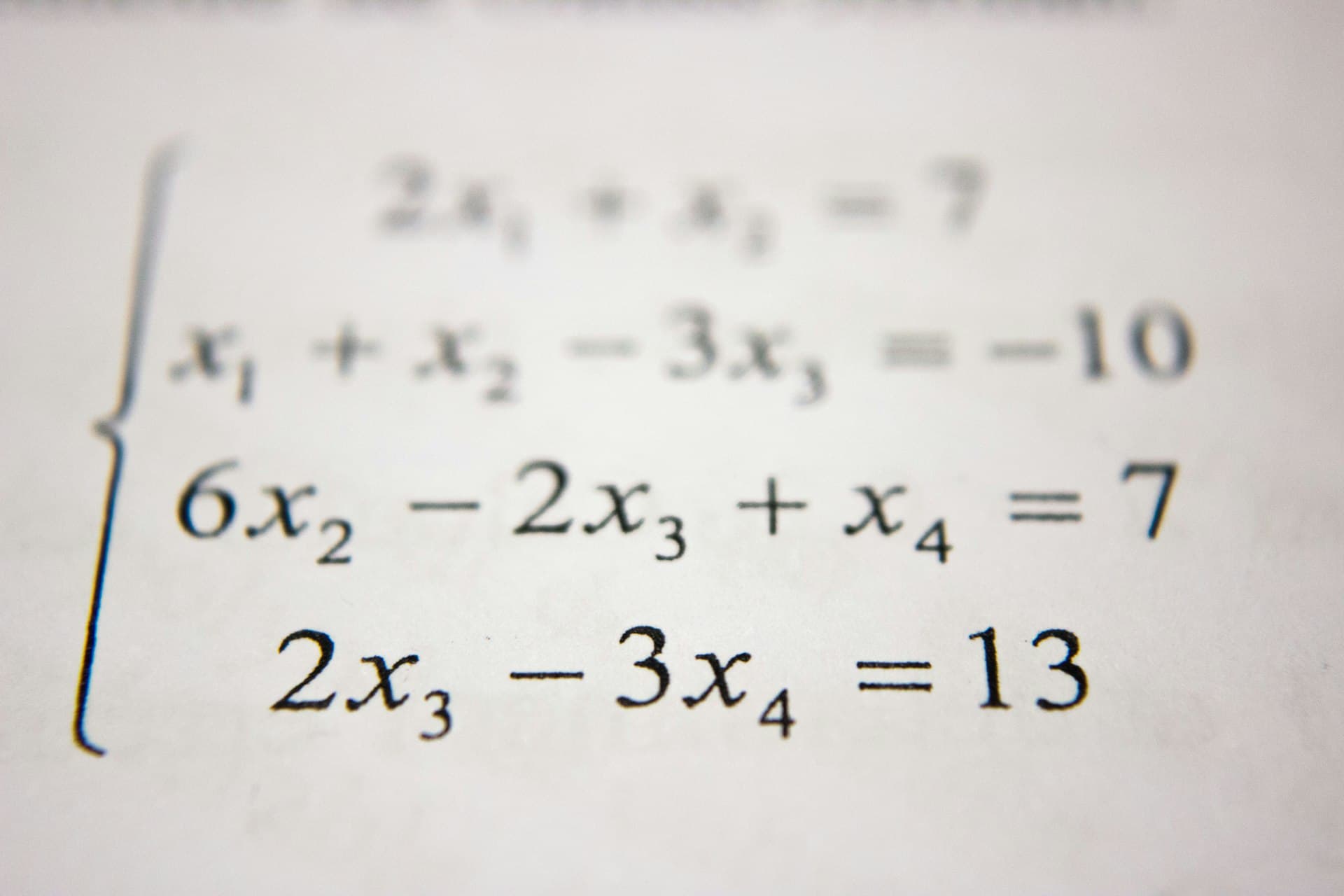 A printed page of algebra equations in close-up