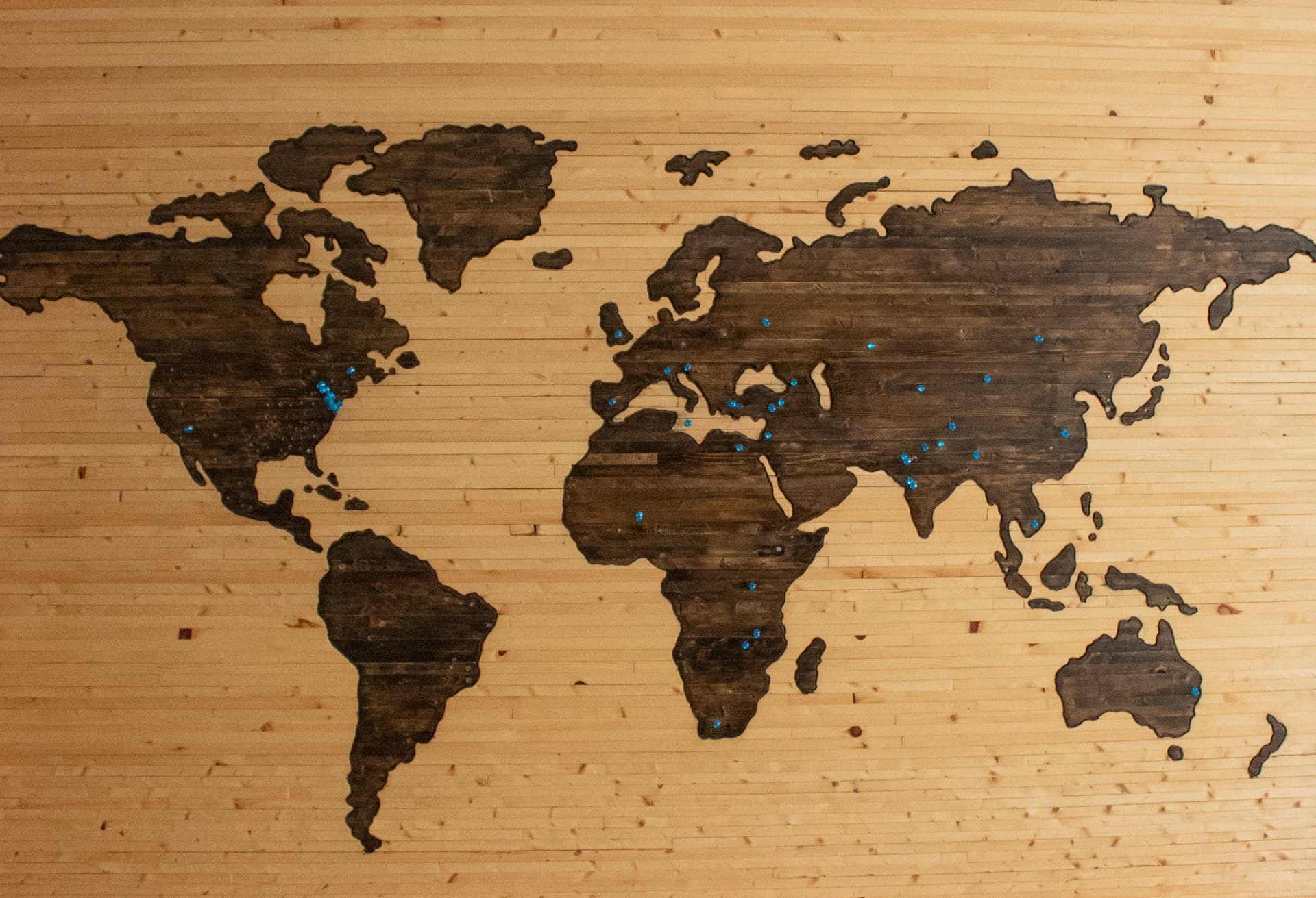 An old world map spread flat, showing continents and ocean routes